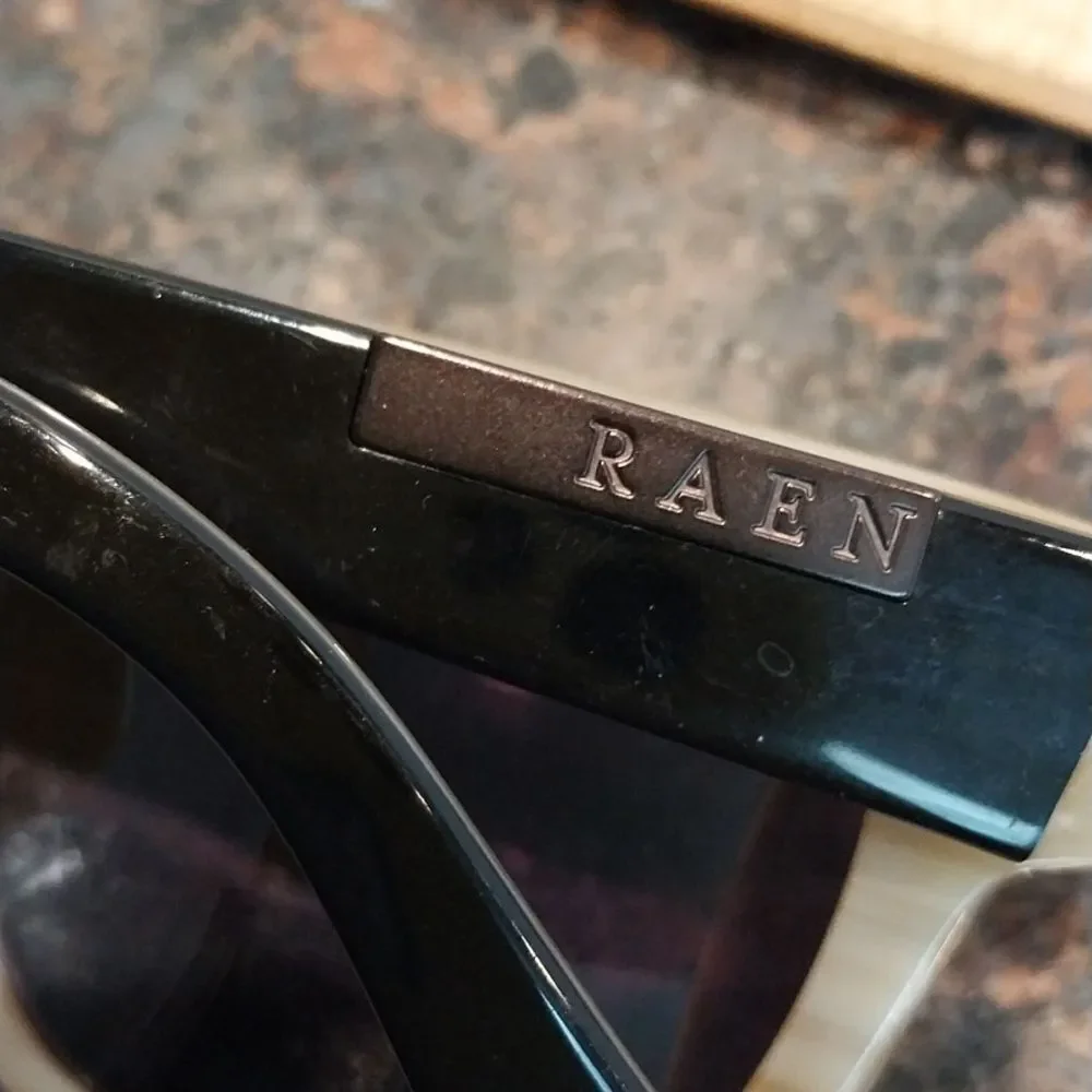 RAEN Black and Gold Frame Sunglasses